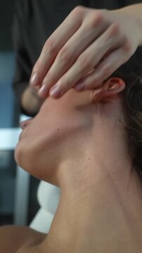 Caucasian woman acupressure client receiving facial point therapy