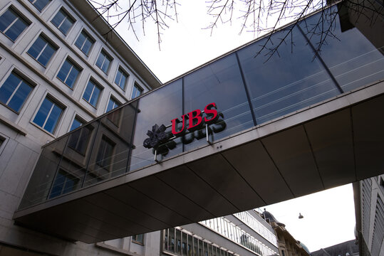 Zurich, Switzerland - 13th of February, 2026: UBS, the biggest Swiss investment bank and financial services provider, logo located on the linkway between two buildings in the city center of Zurich.