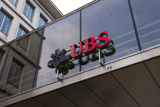 Zurich, Switzerland - 13th of February, 2026: UBS, the biggest Swiss investment bank and financial services provider, logo located on the linkway between two buildings in the city center of Zurich.