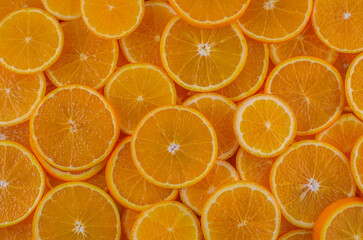 Juicy sliced oranges close up food background studio shot