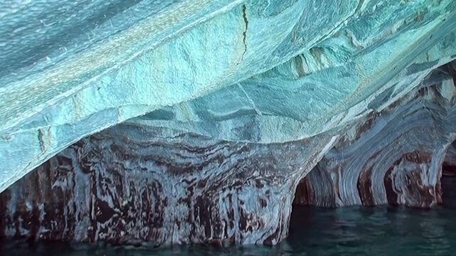 Glimpse the breathtaking beauty of Marble Caves in Patagonia. Observe the stunning azure and white marble formations, carved by nature's gentle hand.