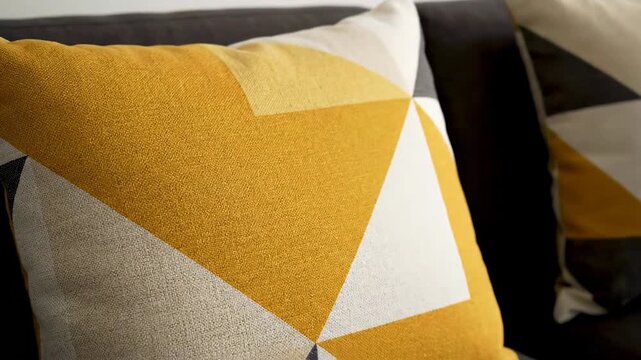Geometric patterned cushions adorn a contemporary sofa