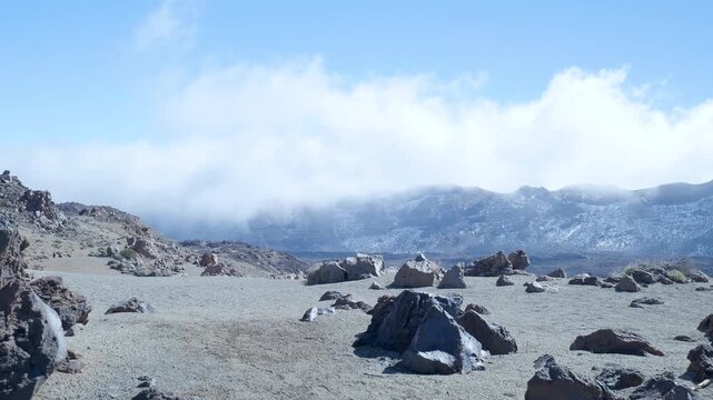 Volcanic landscape with rocks and clouds at teide national park