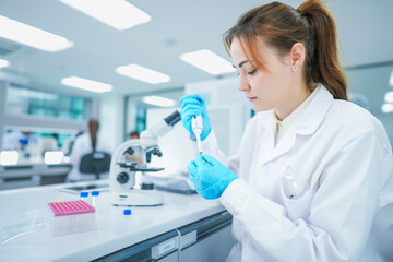 Fototapeta premium Molecular biologist preparing dna sequencing samples via precision micropipette. Genomic researcher executing pcr amplification protocols in sterile modern laboratory.