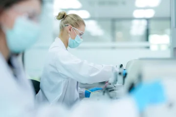 Fototapete Rund Restaurant Pharmaceutical quality control analyst validating equipment sterility protocols. R&D chemist monitoring autoclave sterilization cycle for biopharmaceutical compliance.  © ultramansk