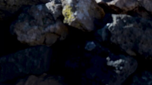 Revealing snowy volcano teide from behind volcanic rocks