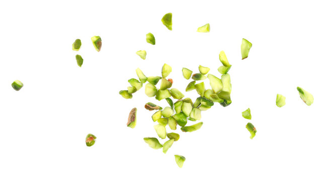 Closeup pistachios chopped pile isolated on white background, top view