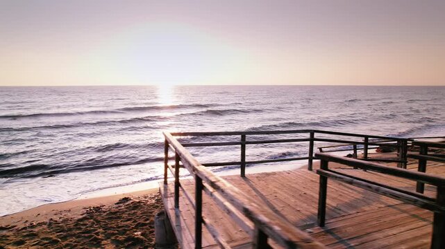 Old Beach Stairs at Sunrise: Tranquil Waves and Golden Light on Long Beach in Iskele
