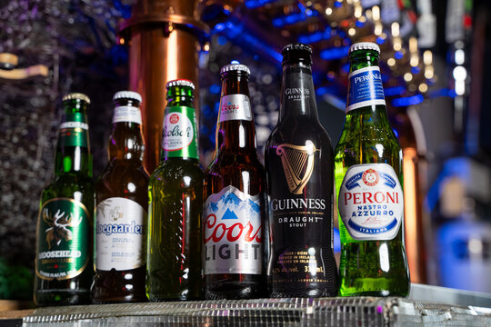 Close up of assorted beer bottles on bar counter. Toronto, Canada - February 20, 2026.