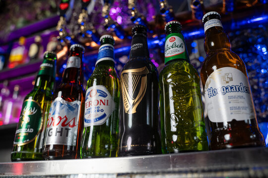 Close up of assorted beer bottles on bar counter. Toronto, Canada - February 20, 2026.