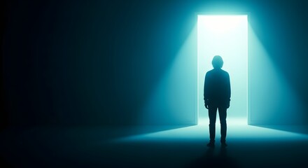Silhouette of person standing in illuminated doorway in dark room