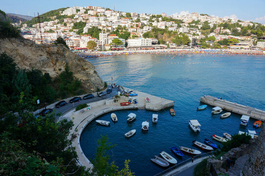 Marina Kacema, beach in background, city on hills. Ulcinj, Montenegro.