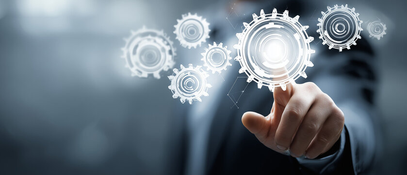 Engrenagens digitais acionadas por profissional representando automa&ccedil;&atilde;o de processos, efici&ecirc;ncia operacional e transforma&ccedil;&atilde;o digital empresarial.