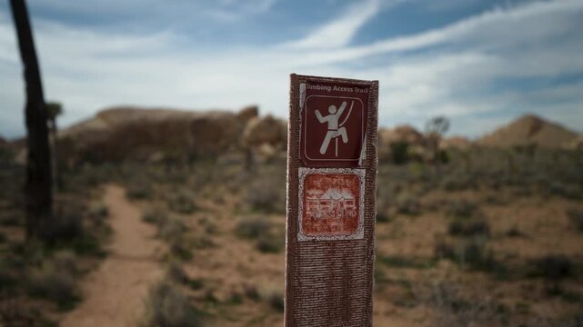 Climbing signs are shown in Joshua Tree National Park, marking important climbing locations and ensuring safety for climbers.