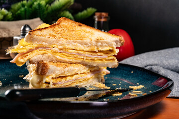 Grilled cheese, eggs and ham sandwich.