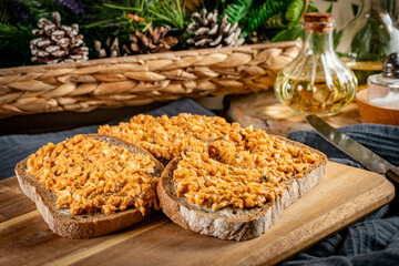 Slices of bread with egg and sprat paste in tomatoes