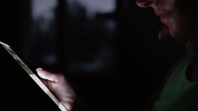 Female Hand Touching Smartphone Screen Indoors Beside Window During Nighttime
