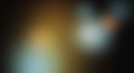 Abstract moody background with blue, gold, and orange bokeh lights