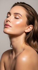 Naklejka premium Young woman with luminous, glowing skin and highlighted features, embodying radiant beauty and skincare