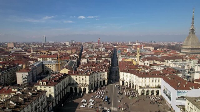 Aerial drone view of Gran Madre di Dio church and Vittorio Emanuele I bridge over the Po river in Turin, Italy, historic city panorama, urban architecture, scenic hill landscape.
