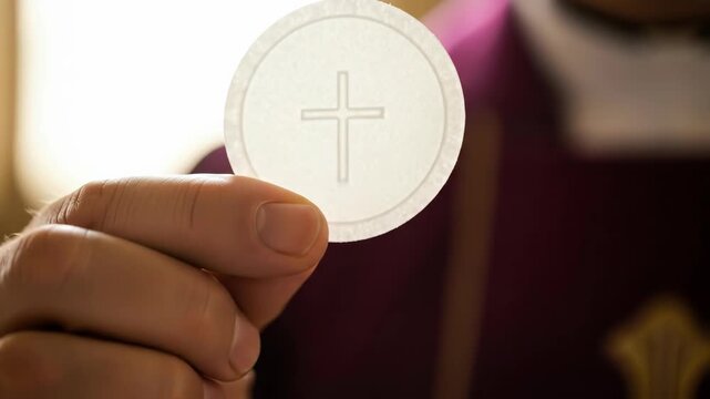 Priest or minister holding a communion wafer with a cross, religious ceremony or eucharist sacrament. Spiritual moment for worship.