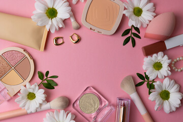 Makeup cosmetics and flowers on pastel background top view. Spring, new products, updates. place for text © Fotomoment001