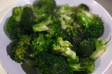 Fresh Broccoli Head on Rustic Surface