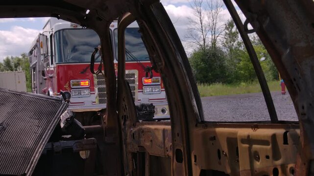 Firefighters on the scene with a car crash performing a rescue