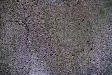 Gray concrete wall texture. Light green and pastel colors. Scratches, cracks and colored spots