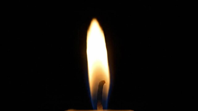 Orange candle flame on wick with dark background mood light animation