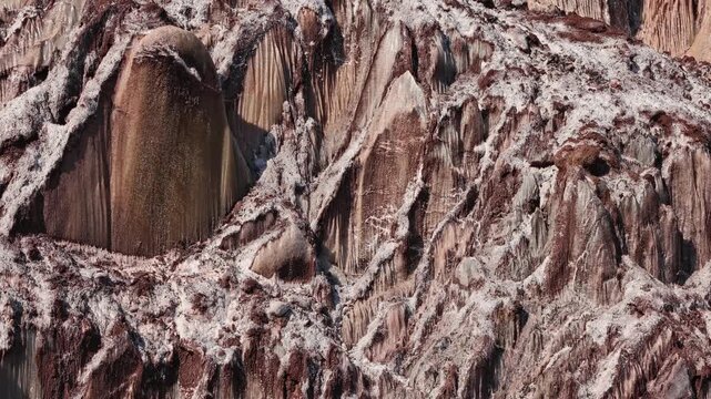 Colorful salt mountains on Hormuz Island in Iran, known as the Rainbow Island, featuring surreal mineral Martian landscape and vivid natural patterns in Persian Gulf. Unique geological formations 