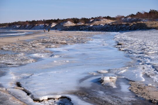 Frozen beach of Baltic Sea around breakwater of Jamno Canal, Mielno. Western Pomerania, Poland