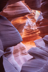 Oink and orange coloured swirling natural patterns formed by erosion over millennial in Navajo Sandstone of Antelope slot canyons near Page
