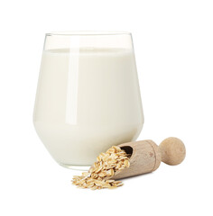 Oat milk in glass and flakes isolated on white