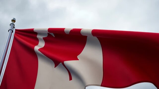 Canada national flag waving on a flagpole under a cloudy sky. Patriotic symbol for national identity and celebration.