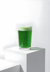 Minimal still life photo of green beer with natural light and clean background, representing festive St. Patrick&rsquo;s Day celebration.