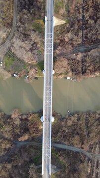 Vertical aerial top-down view of a bridge over the Tamis river