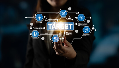 Fototapeta premium A professional businesswoman presents an illuminated light bulb symbolizing ideas and targets, surrounded by icons representing achievement, resolution, and perseverance in a digital setting. Tessel