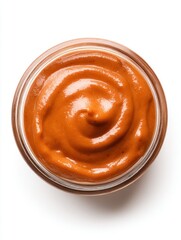 Fototapeta premium Top view of a jar filled with creamy, rich tomato sauce swirled into a perfect spiral