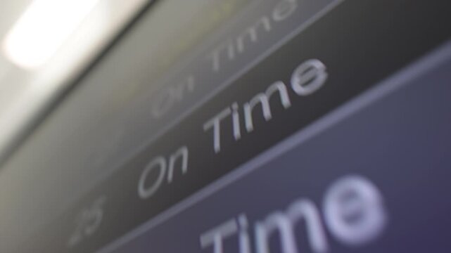 Flight listing board at an airport showing delayed and cancelled flights in Canada
