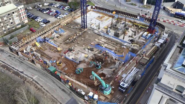 High-Angle Aerial View of a Major City Construction Site in Birmingham, England.
A high-angle bird's-eye view capturing the active groundworks phase of a large-scale urban development project.
