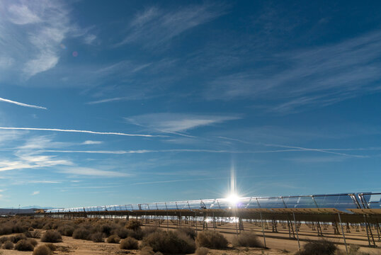 USA, CA, Mojave.  Sunlight glistens on reflective surface of solar panel.  Solar energy farm in the Mojave desert.