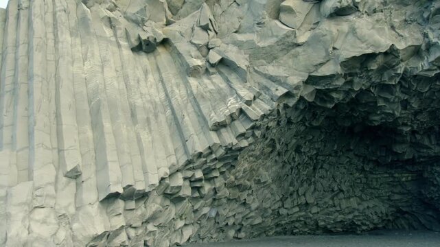 Iconic basalt columns forming a natural cave on the famous Reynisfjara beach in southern Iceland