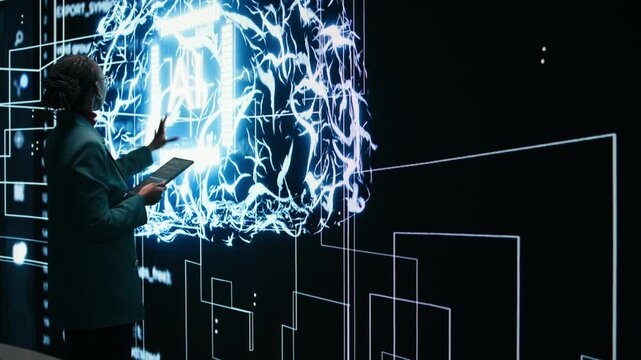 Technician implements digital guardrails on autonomous AI system using tablet to limit risk. African american woman applies artificial intelligence safety constraints with device