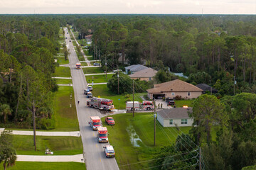 First responders arrived at fire alarm call ready to extinguish fire of burning house. Emergency...