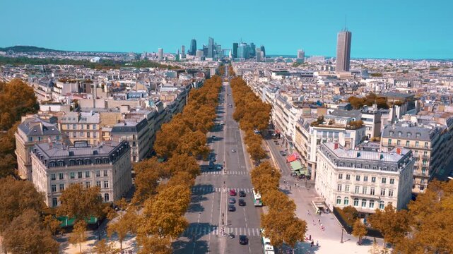 An aerial video shot from the Arc de Triomphe shows modern buildings in the suburbs of Paris in the background.