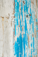 Obraz premium Peeling teal and beige paint on rustic wood background