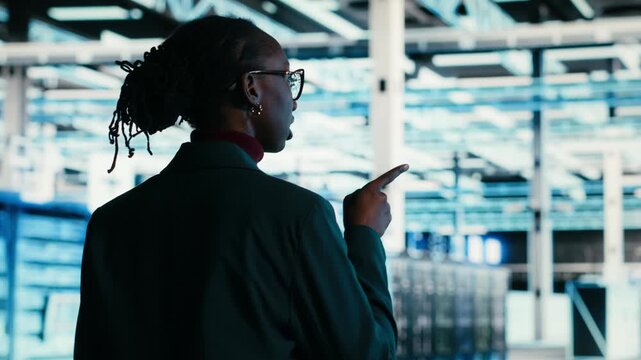 Debugging system errors, AR technology and software developer in data center using tablet. Running equipment diagnostics, wireframe mesh supercomputer and professional walking in server farm, camera B