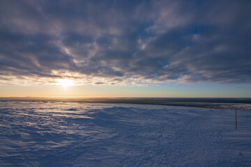 Hiking to the summit of Mount Kiilopää during a spectacular arctic sunset in Finnish Lapland. © julen