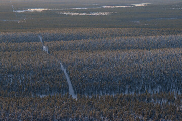 Hiking to the summit of Mount Kiilopää during a spectacular arctic sunset in Finnish Lapland. © julen